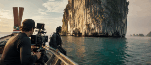 Camera crew filming from a picture boat off an Andaman island with a marine safety unit on standby